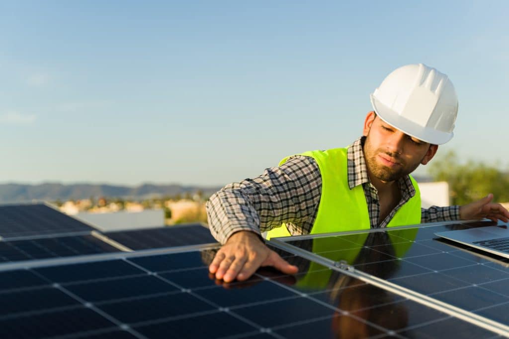 Renewable Energy Careers in Sydney, Melbourne, and Brisbane: Opportunities in Australia's Clean Energy Future 3 Attractive latin engineer working with solar panels